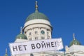 Demonstrator carrying sign No to war in Russian ÃÂÃÂµÃâ ÃÂ²ÃÂ¾ÃÂ¹ÃÂ½ÃÂµ